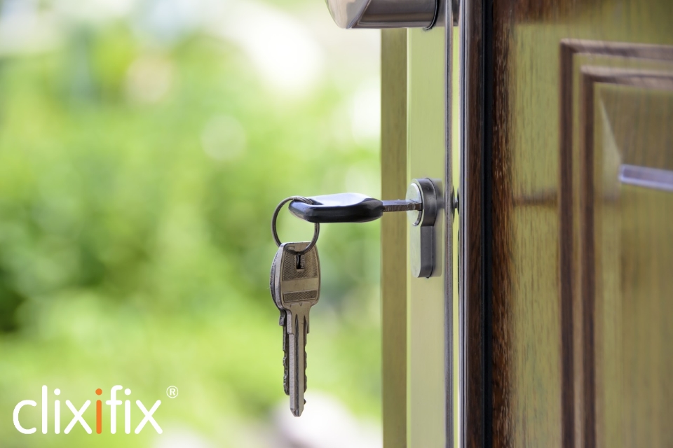 keys in door with logo